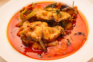 Catfish with spicy red curry paste.