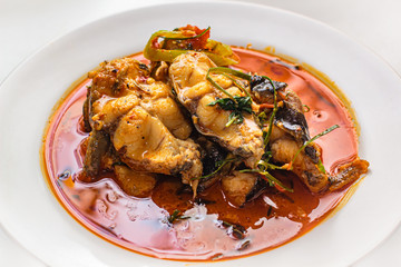 Catfish with spicy red curry paste.