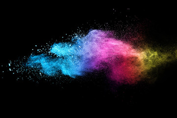 Explosion of colored powder isolated on black background. Abstract colored background. holi...