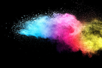 Explosion of colored powder isolated on black background. Abstract colored background. holi...