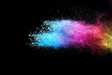 Explosion of colored powder isolated on black background. Abstract colored background. holi festival.