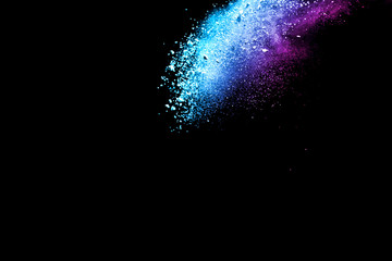 Obraz premium Explosion of colored powder isolated on black background. Abstract colored background. holi festival.