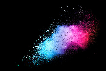 Explosion of colored powder isolated on black background. Abstract colored background. holi...