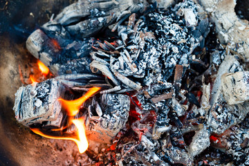 Embers in a bonfire close-up