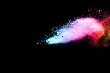 Explosion of colored powder isolated on black background. Abstract colored background. holi...