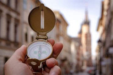 Visit to Kraków / Poland. compas showing the way to the most important monuments in the city / tourism concept © Rochu_2008