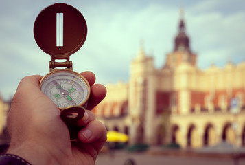 Visit to Kraków / Poland. compas showing the way to the most important monuments in the city / tourism concept © Rochu_2008