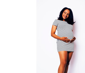 young pretty african american woman pregnant happy smiling, posing on white background isolated , lifestyle people concept copyspace close up