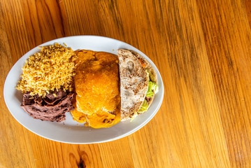 Cheese Enchilada meal with rice, beans and beef taco
