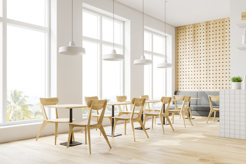 White and wooden restaurant corner with sofa