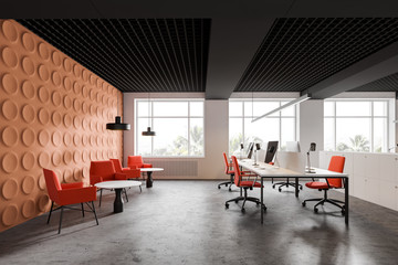 Bright orange office with lounge area