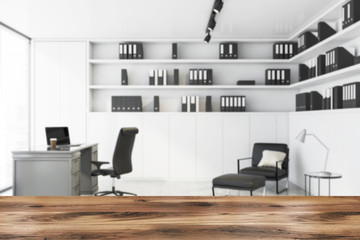 Table for product in blurred white CEO office