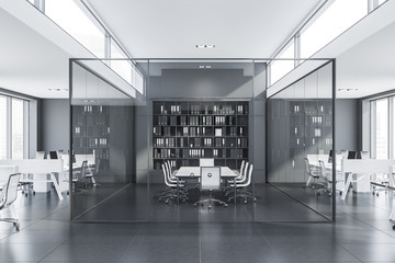 Glass meeting room in gray office