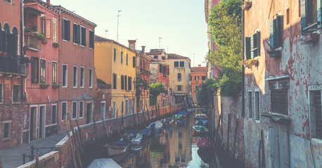 Beautiful view of the traditional water channel in Venice in the morning. View on canal with motor boats water. Picturesque landscape.