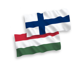 National vector fabric wave flags of Finland and Hungary isolated on white background. 1 to 2 proportion.