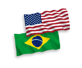 National vector fabric wave flags of Brazil and USA isolated on white background. 1 to 2 proportion.