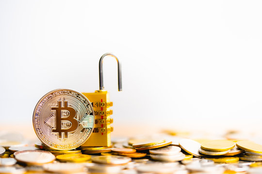 Bitcoin(BTC) coin with padlock lying on coins stack. Bitcoin security. digital cyber safety or security encryption, Blockchain technology to encode online information or data protection.