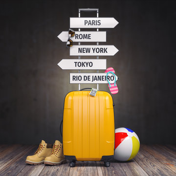 Yellow suitcase and signpost with travel destination.Tourism and  travel concept background.