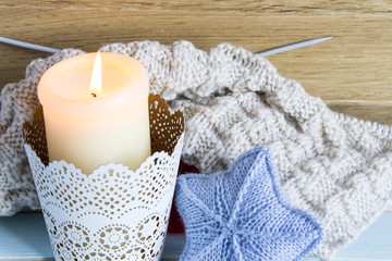 Winter home background. The concept of winter female needlework. Christmas and New Year theme. Knitted christmas ornaments.