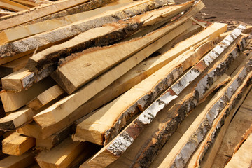 sawing trees into small bars. tree processing. logging for the winter.