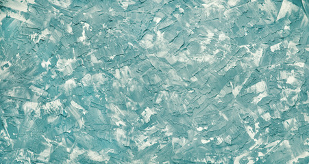 Abstract textural background in white-turquoise color. Hard surface texture background for design and decoration. Texture touches of turquoise and white of putty and paint.