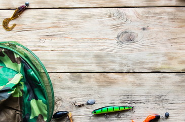 fishing tackle on a light old wooden background © FytyaKarman