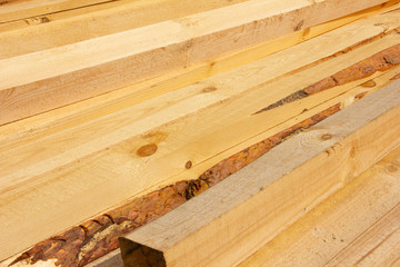 processed boards at a sawmill. Smooth, turned, polished boards at a wood processing plant.