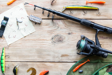 fishing tackle on a light old wooden background