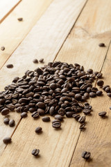 coffee beans on wooden table background. space for text