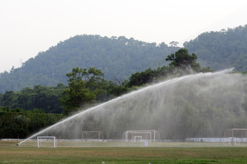 soccer field is hosed. Concept - Sports