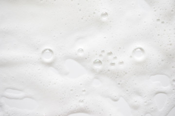 Abstract background white soapy foam texture. Shampoo foam with bubbles