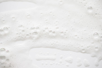 Abstract background white soapy foam texture. Shampoo foam with bubbles