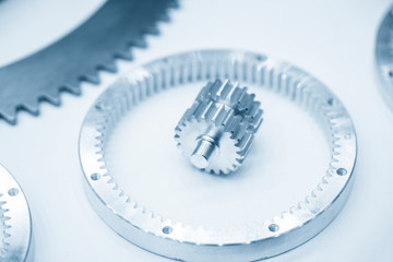 Close-up of the planetary gear parts on the white background. The automatic transmission gear parts.
