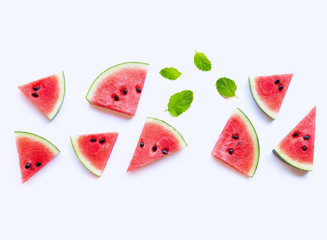 Sweet watermelon slices with mint leaves on white