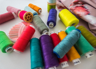 Spools with colored cotton threads for sewing, sewing accessories, needles set