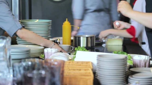 Close-up of women's hands give out coffee at the bar waiters