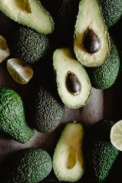 Closeup photo of raw avocados into a wooden box