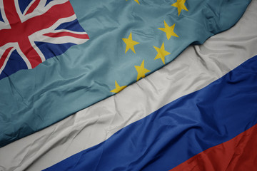 waving colorful flag of russia and national flag of Tuvalu.