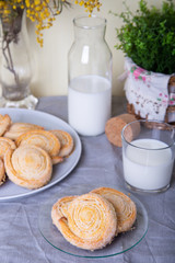 Cottage cheese homemade cookie in sugar topping with milk. Selective focus, close-up.