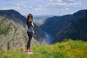 Young woman contemplating the Sil Canyons in Ourense, Spain