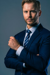 elegance caucasian Successful businessman  with beard close up wear formal suit tie grey background