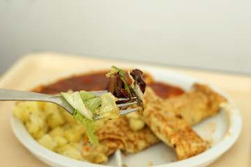 Crepes with tomato ragout as a delicious dinner in a hospital