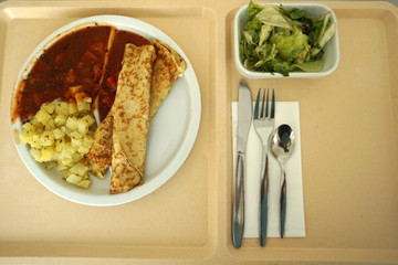 Crepes with tomato ragout as a delicious dinner in a hospital