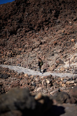 Woman walking on the top of the Teide volcano in Tenerife, Spain