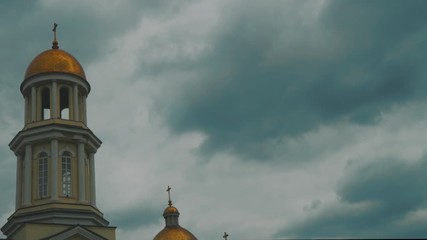 Stormy, dramatic clouds over the Christian Church