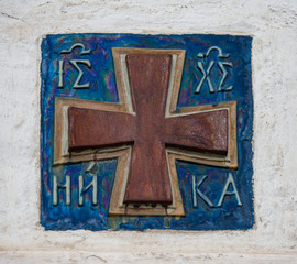 Bright colored ceramic tiles, mounted in a white wall, is a precious decoration of the whole building. Christian symbolism corresponds to the place of its installation.     