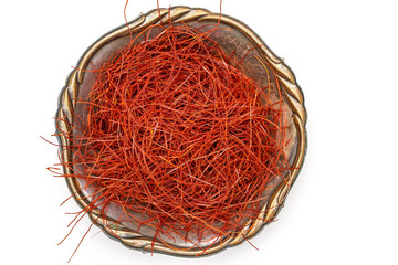 Naklejka premium Lot of whole red chili pepper threads in old iron bowl flatlay isolated on white background