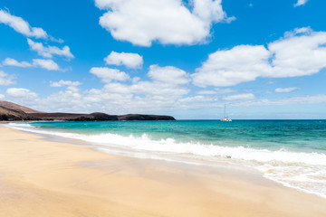 Fototapeta na wymiar Panorama of beautiful beach and tropical sea of Lanzarote. Canaries