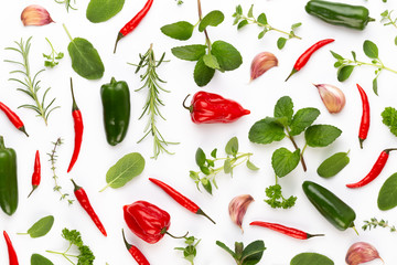Spice herbal leaves and chili pepper on white background. Vegetables pattern. Floral and vegetables on white background. Top view, flat lay.