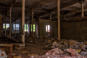 Fototapeta na wymiar Workshop interior of an abandoned collapsing factory
